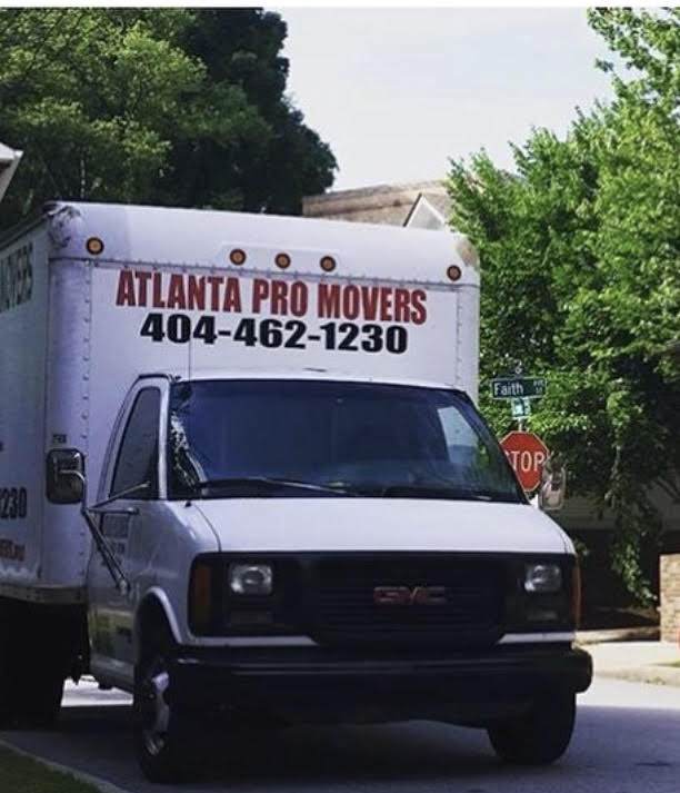 Atlanta Pro Movers branded truck parked on a residential street in Metro Atlanta with company contact number clearly displayed.